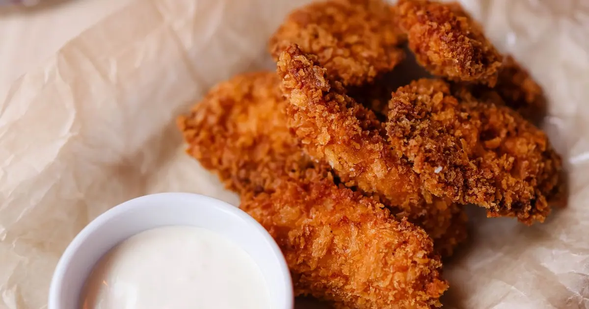 Crispy chicken tenders on a plate - High-protein Wingstop: protein in every wing, tender and sandwich