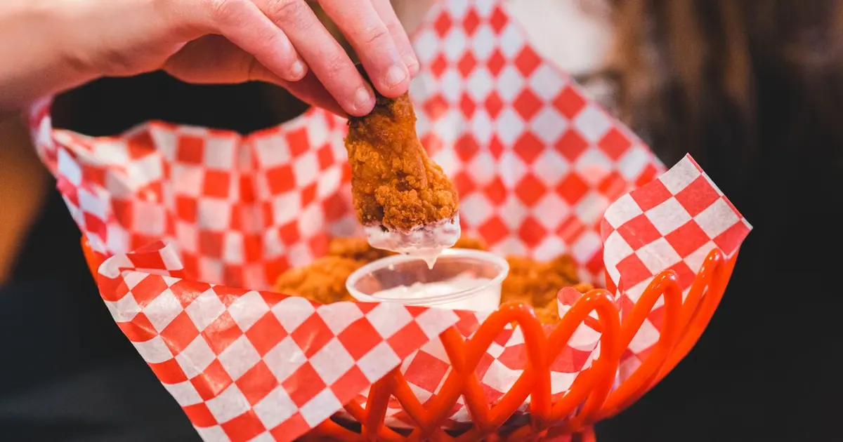 A shared platter of chicken wings with dips - How many Wingstop wings per person?