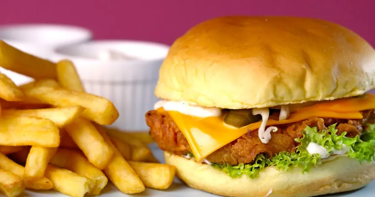 A sandwich, fries and dips on a table - Wingstop wing combos explained: sizes, what you get and prices
