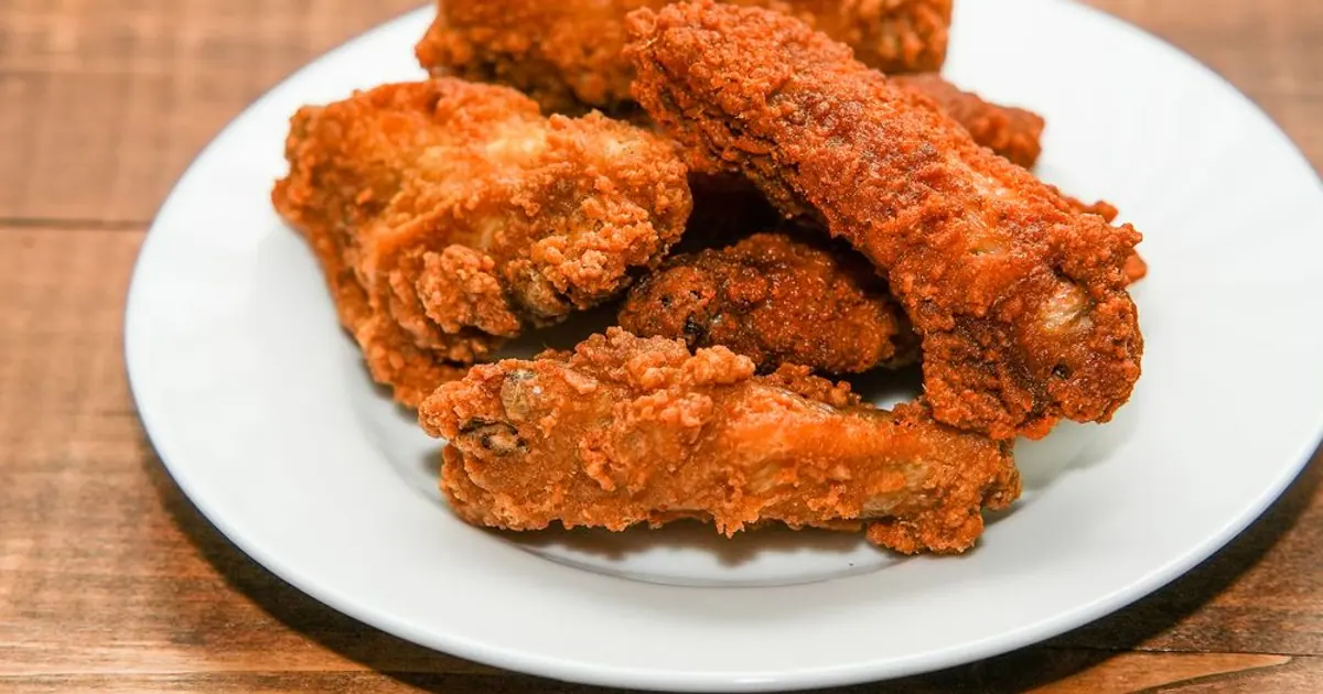 A plate of crispy chicken wings - Wingstop cost per wing: what each wing really costs