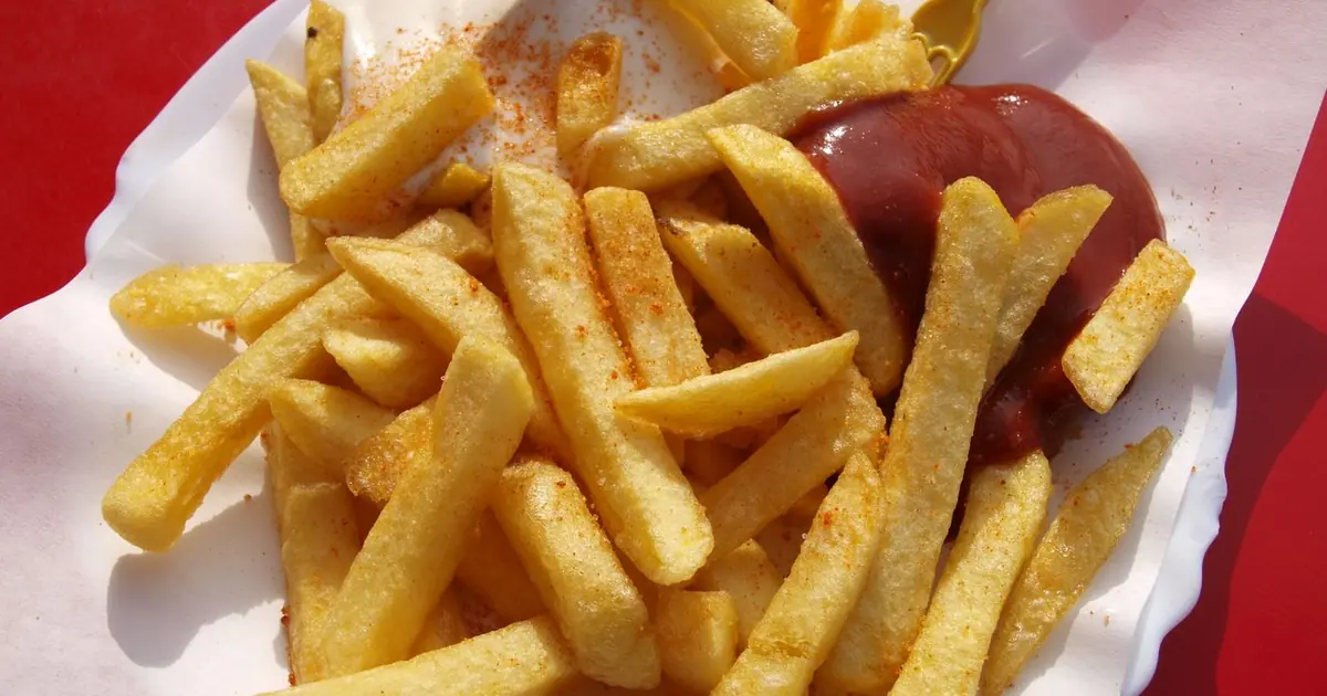 A serving of golden seasoned french fries - Wingstop fries and sides, ranked with calories and prices